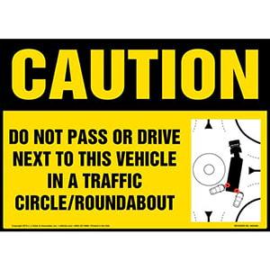 Caution: Do Not Pass Or Drive Next To This Vehicle In A Traffic Circle / Roundabout Sign with Icon - OSHA